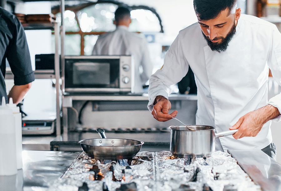 chef preparing food in a commercial kitchen